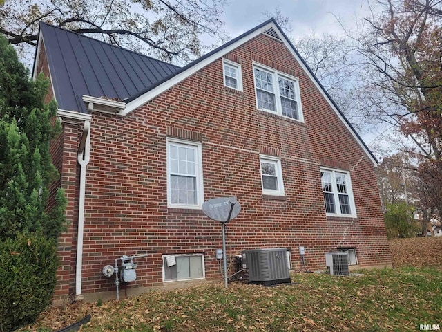 view of home's exterior featuring central AC unit