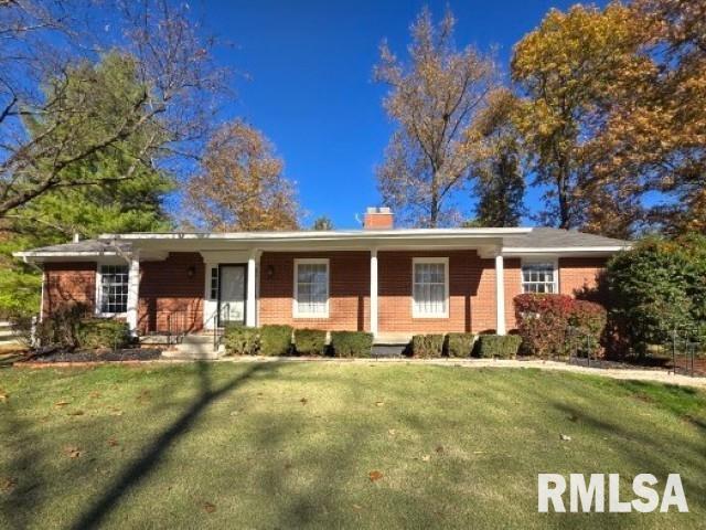 2500 Pace Ave, Mount Vernon, IL 62864 - single story home featuring a front lawn, a chimney, and brick siding