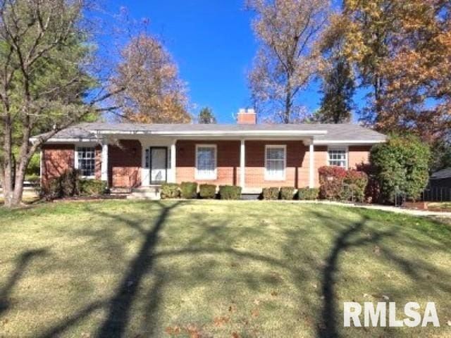 ranch-style house with a front yard