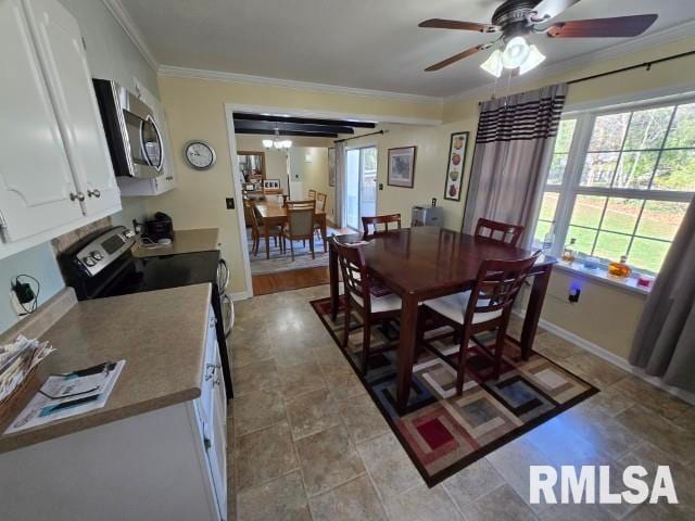 dining room featuring crown molding and ceiling fan