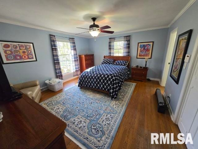 bedroom with multiple windows, ceiling fan, crown molding, and dark wood-type flooring