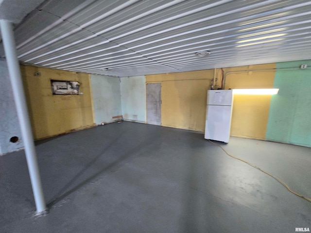 basement featuring white refrigerator