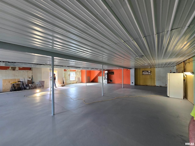 garage with white fridge