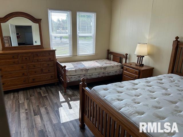 bedroom featuring dark hardwood / wood-style flooring