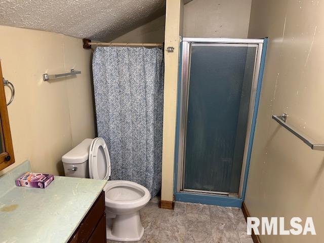 102 W 3rd St, Ina, IL 62846 - full bath featuring vanity, a stall shower, and a textured ceiling