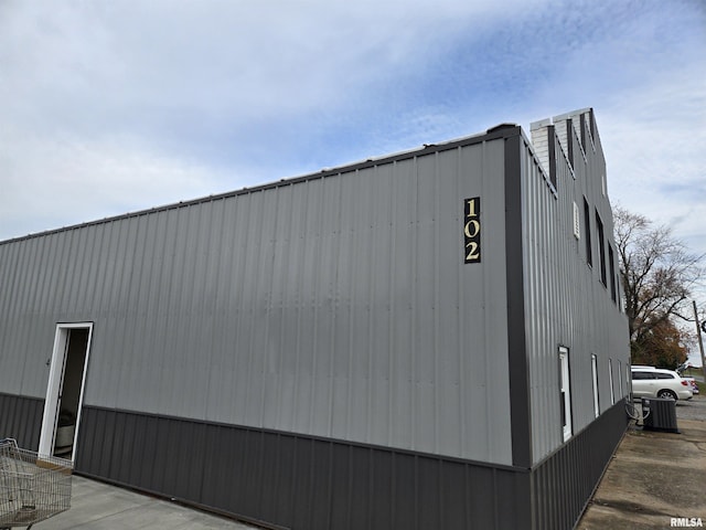 102 W 3rd St, Ina, IL 62846 - view of property exterior with a central AC unit