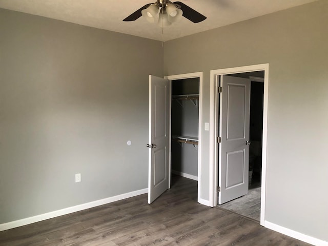 unfurnished bedroom with hardwood / wood-style floors, a closet, and ceiling fan