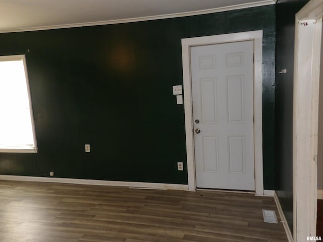 805 Samuel St, Christopher, IL 62822 - foyer entrance featuring wood finished floors, baseboards, and crown molding
