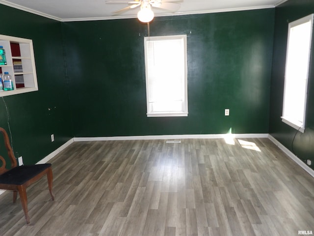 805 Samuel St, Christopher, IL 62822 - unfurnished room featuring ceiling fan, ornamental molding, baseboards, and wood finished floors