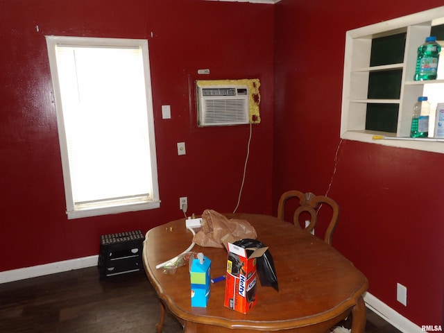 805 Samuel St, Christopher, IL 62822 - dining room with healthy amount of natural light, wood finished floors, baseboards, and a wall mounted AC