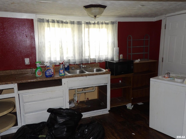 805 Samuel St, Christopher, IL 62822 - kitchen featuring a sink, black microwave, dark wood-type flooring, and white cabinets