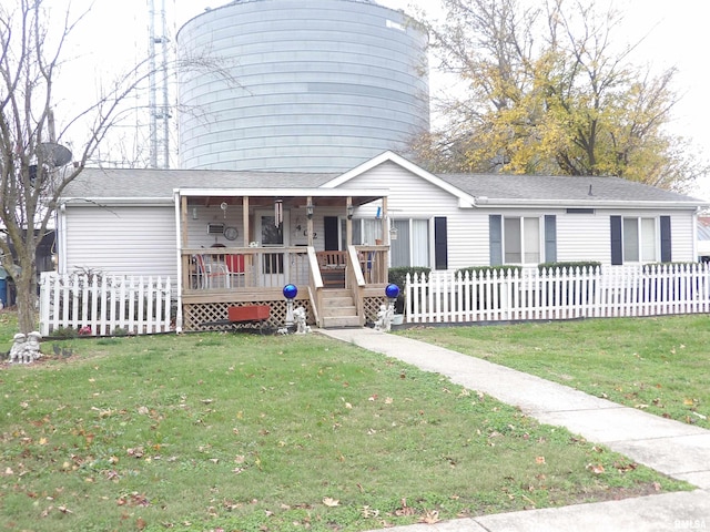 view of front of property with a front yard and a porch