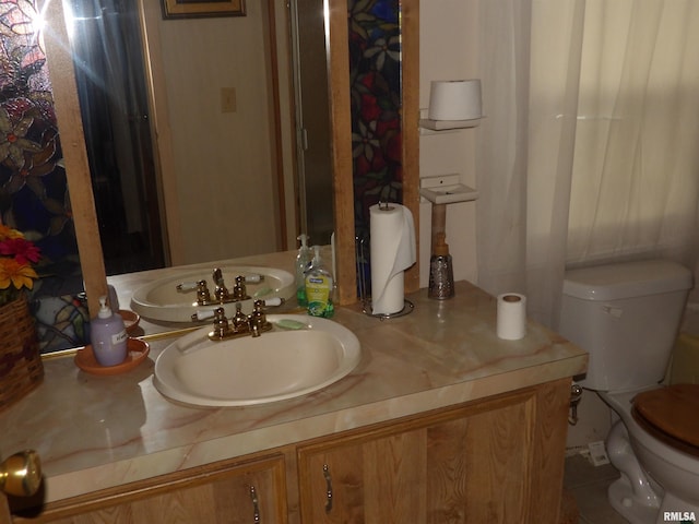 bathroom with vanity and toilet