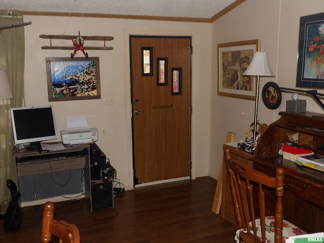 entryway with a textured ceiling, lofted ceiling, dark hardwood / wood-style floors, and ornamental molding