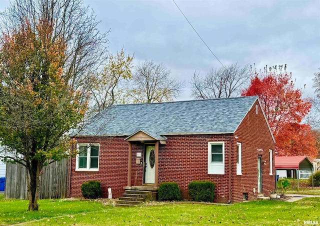 view of front of home with a front lawn