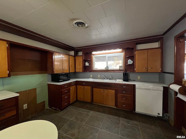 kitchen featuring dishwasher, ornamental molding, dark tile patterned flooring, and sink