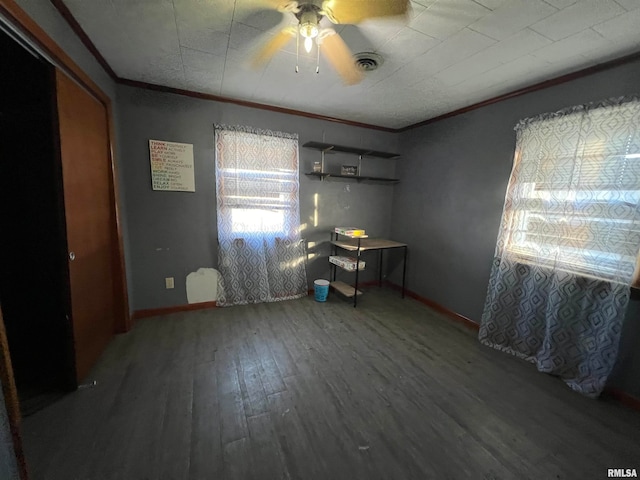 unfurnished bedroom featuring ceiling fan, wood-type flooring, and ornamental molding