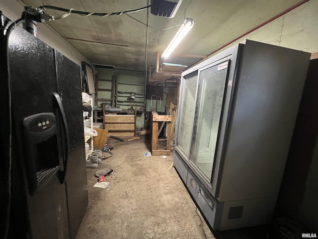 202 S Elm St, Cambria, IL 62915 - basement featuring black refrigerator with ice dispenser