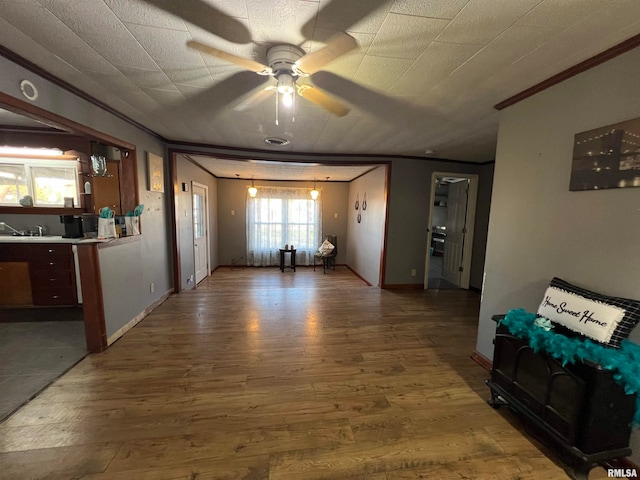 corridor with crown molding and wood-type flooring