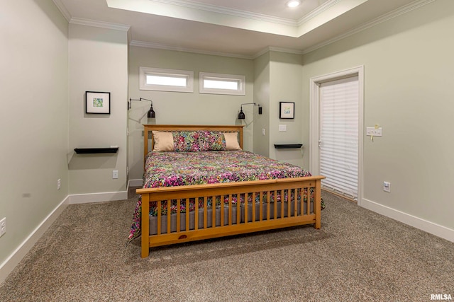 bedroom with carpet, a raised ceiling, and crown molding