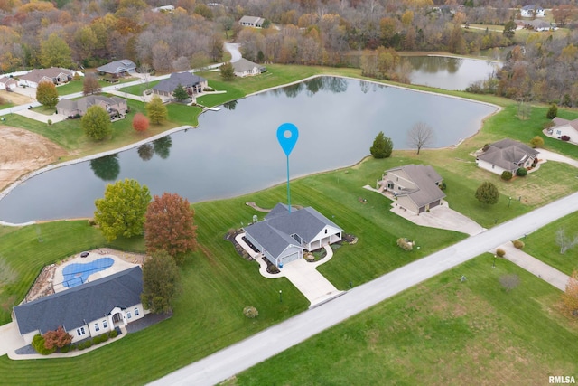 bird's eye view with a water view