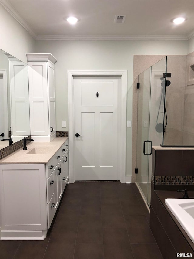 bathroom featuring tile patterned flooring, vanity, an enclosed shower, and crown molding