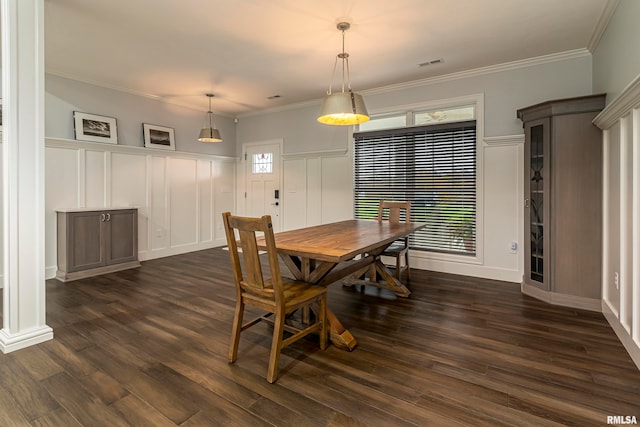 dining room featuring ornamental molding and dark wood-type flooring