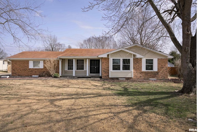 single story home with a front lawn, brick siding, and crawl space