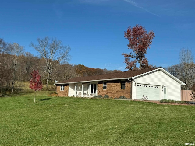 ranch-style house with a garage and a front yard