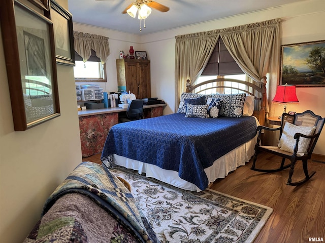 bedroom featuring hardwood / wood-style floors and ceiling fan