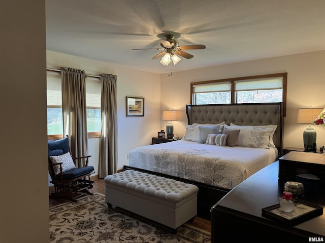 bedroom featuring wood-type flooring and ceiling fan