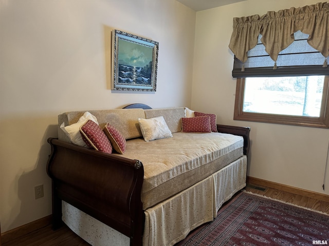 bedroom featuring dark wood-type flooring