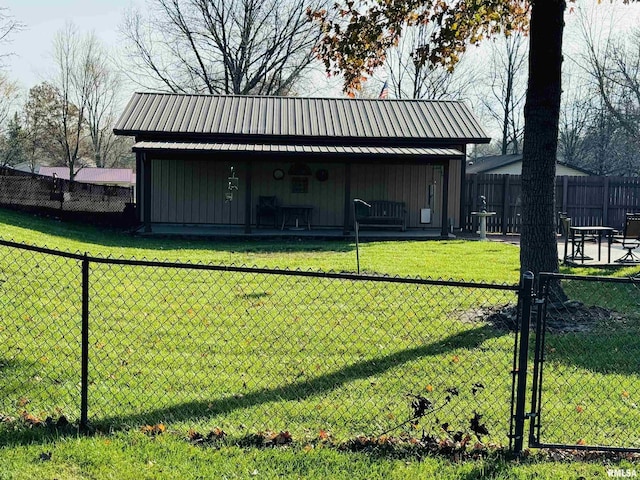 view of outbuilding featuring a yard