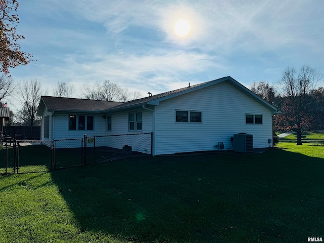 back of property with a yard and cooling unit