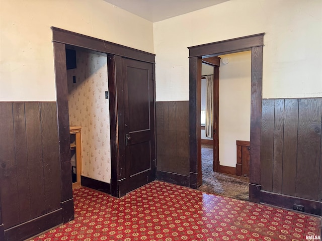 hallway with wooden walls