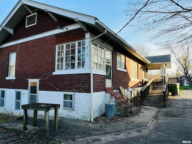 view of property exterior featuring a sunroom