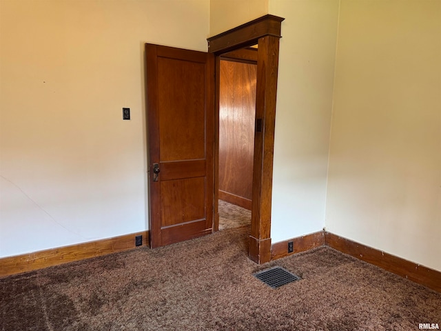 empty room with carpet flooring