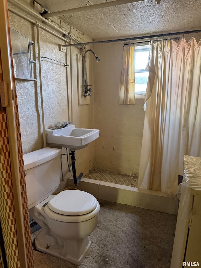 bathroom featuring curtained shower and toilet