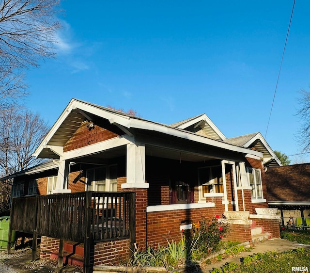 view of side of home featuring a porch