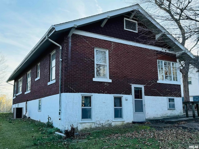 rear view of property with cooling unit