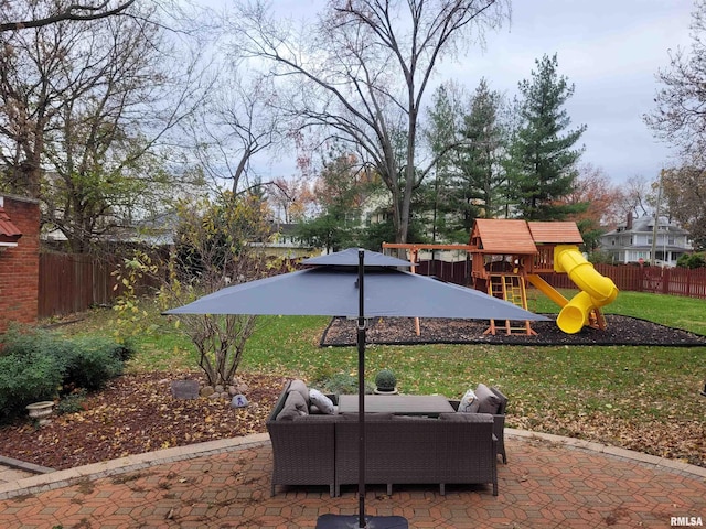 exterior space with an outdoor living space, a playground, and a patio