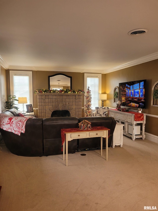 living room featuring a healthy amount of sunlight, light colored carpet, and crown molding