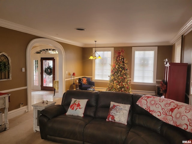 carpeted living room featuring ornamental molding