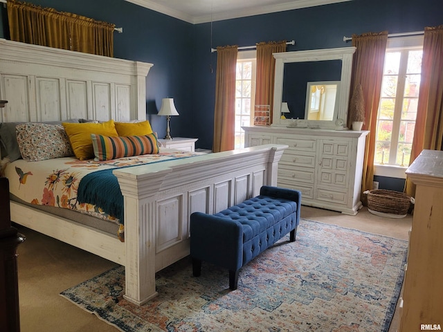 bedroom with multiple windows, light colored carpet, and ornamental molding