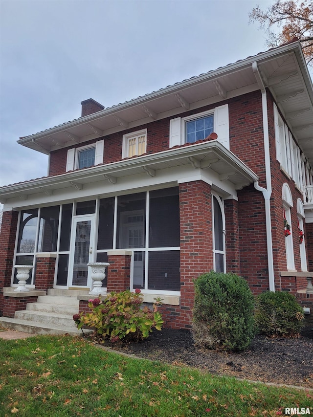 view of front of property with a sunroom