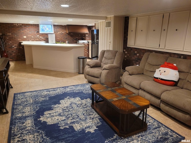 tiled living room with brick wall