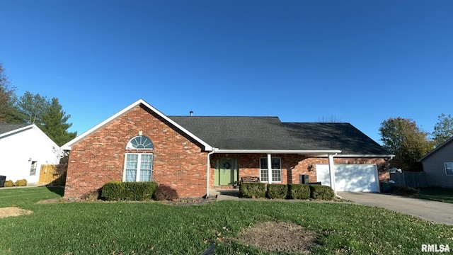 view of front of home featuring a garage and a front lawn