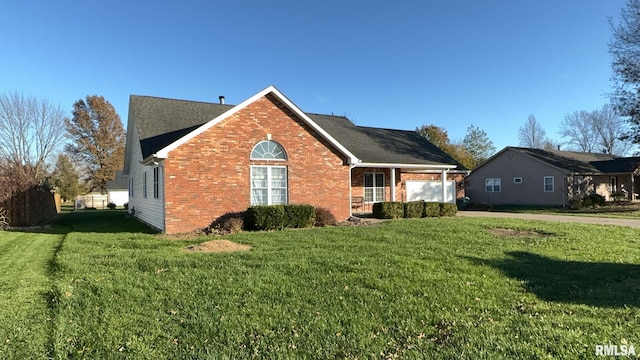 view of side of property with a lawn