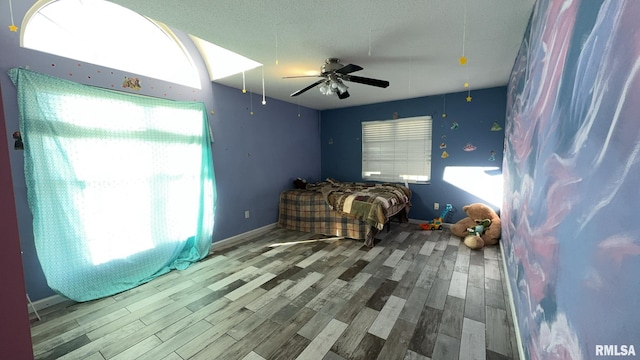 bedroom featuring ceiling fan and light wood-type flooring