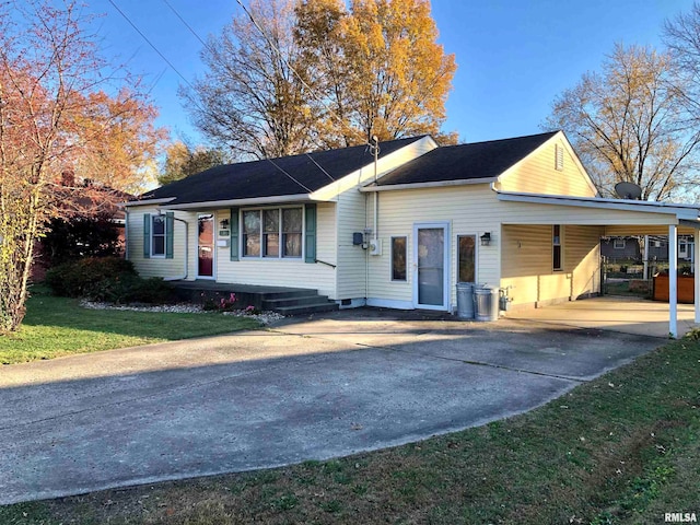 view of front of home featuring a carport